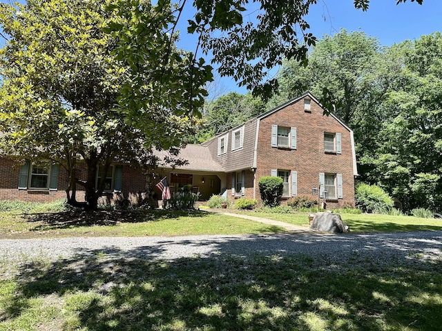 2311 Center Point Rd, Hendersonville, TN 37075 - view of front of home featuring brick siding, a gambrel roof, and a front yard