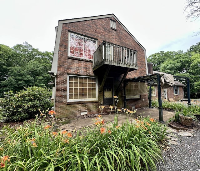 2311 Center Point Rd, Hendersonville, TN 37075 - rear view of house with a balcony, brick siding, a patio, and a pergola