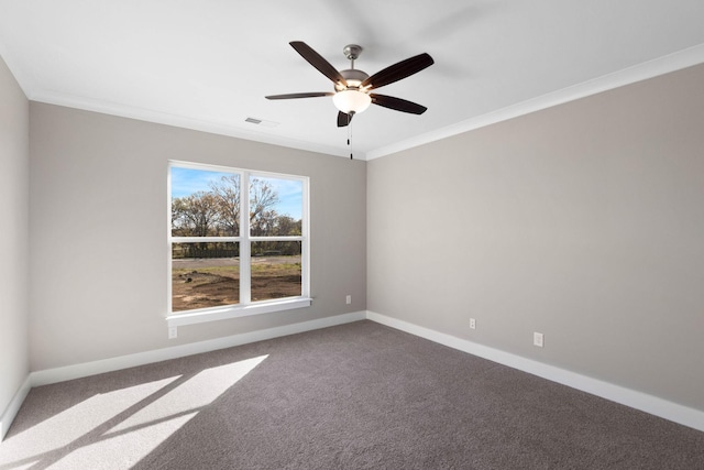 carpeted empty room with baseboards, a ceiling fan, and ornamental molding