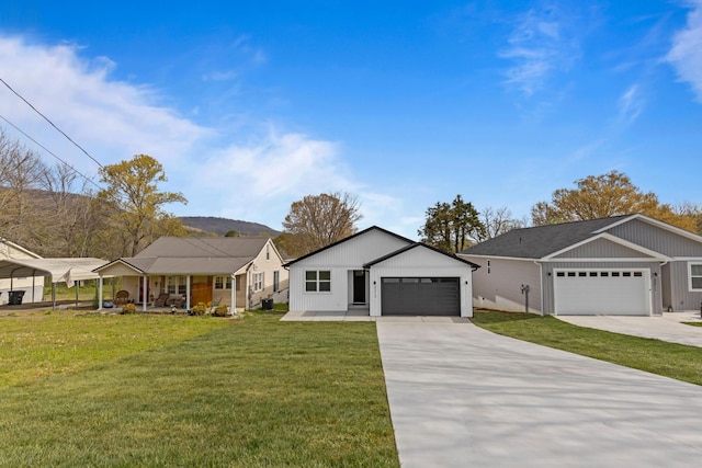 3313 Parker Ln, Chattanooga, TN 37419 - view of front of property featuring a front lawn, a garage, concrete driveway, and covered porch