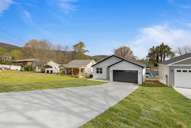 3313 Parker Ln, Chattanooga, TN 37419 - ranch-style house with a front yard, a garage, a residential view, and concrete driveway