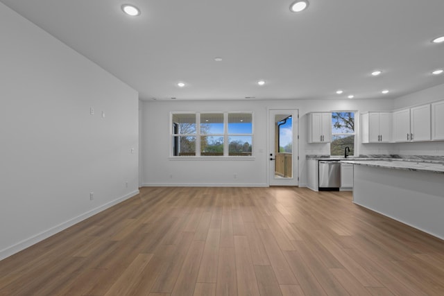 3313 Parker Ln, Chattanooga, TN 37419 - kitchen featuring stainless steel dishwasher, recessed lighting, white cabinets, wood finished floors, and baseboards