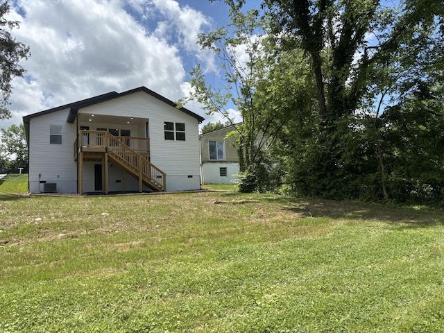 3313 Parker Ln, Chattanooga, TN 37419 - back of house featuring stairs, a lawn, and central AC unit