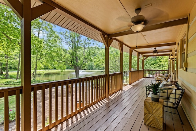 1708 Sugar Ridge Rd, Spring Hill, TN 37174 - wooden terrace with a water view, ceiling fan, and view of scattered trees