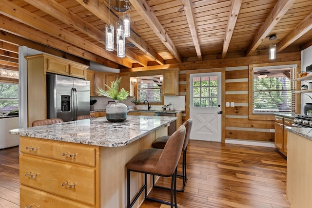 1708 Sugar Ridge Rd, Spring Hill, TN 37174 - kitchen featuring appliances with stainless steel finishes, wooden ceiling with exposed beams, light wood-style floors, a kitchen island, and wood walls