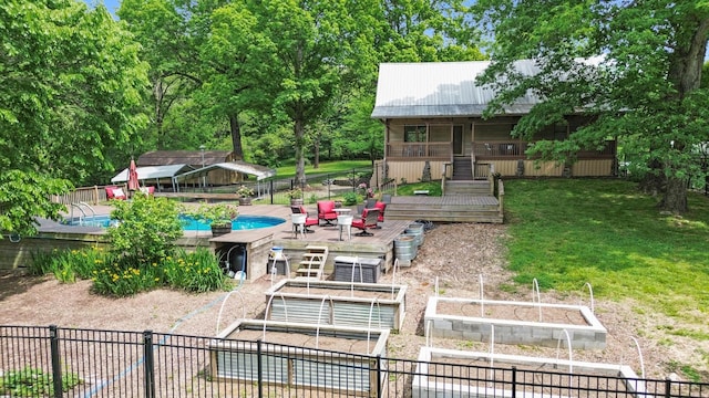1708 Sugar Ridge Rd, Spring Hill, TN 37174 - back of property featuring a vegetable garden and metal roof
