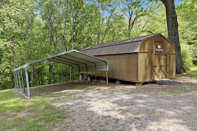 1708 Sugar Ridge Rd, Spring Hill, TN 37174 - view of outbuilding with a carport and a view of trees