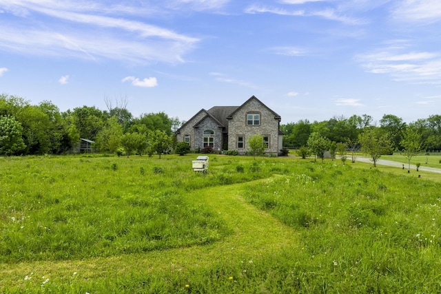 french country style house featuring stone siding