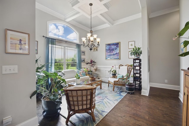 living room with ornamental molding, a chandelier, coffered ceiling, and wood finished floors