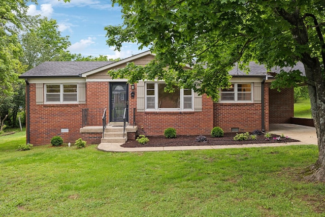 view of front facade featuring brick siding, crawl space, a front yard, and a carport