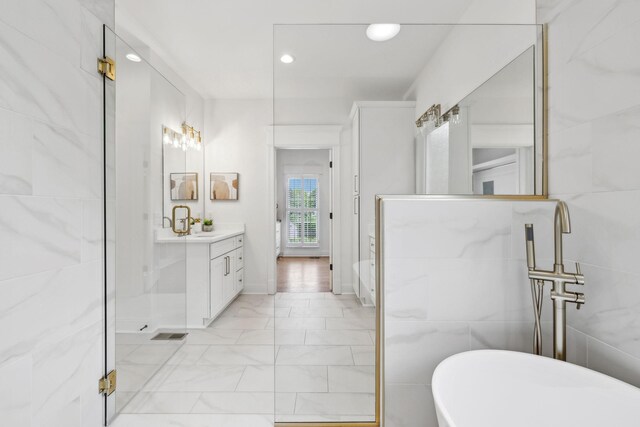 1207 Mullberry Ct, Murfreesboro, TN 37130 - bathroom featuring a shower, a freestanding tub, marble finish floor, vanity, and recessed lighting