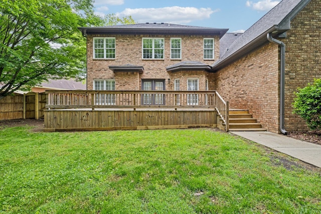 1207 Mullberry Ct, Murfreesboro, TN 37130 - back of house featuring brick siding, a deck, a lawn, and fence