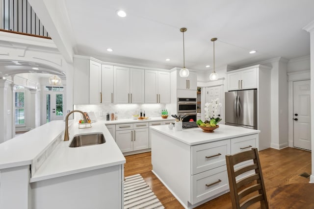 1207 Mullberry Ct, Murfreesboro, TN 37130 - kitchen featuring a sink, stainless steel appliances, backsplash, and white cabinets