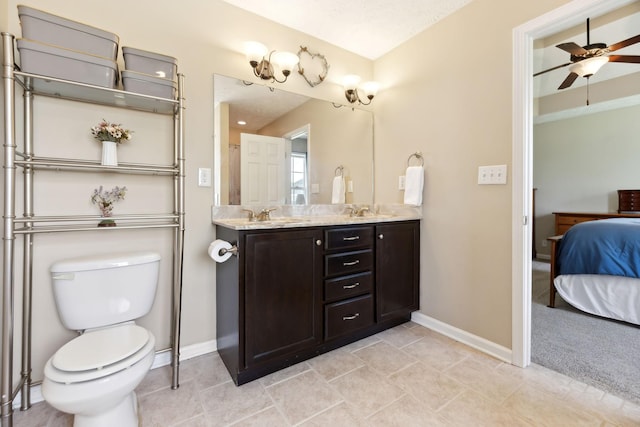 full bath with baseboards, ensuite bath, ceiling fan, and toilet