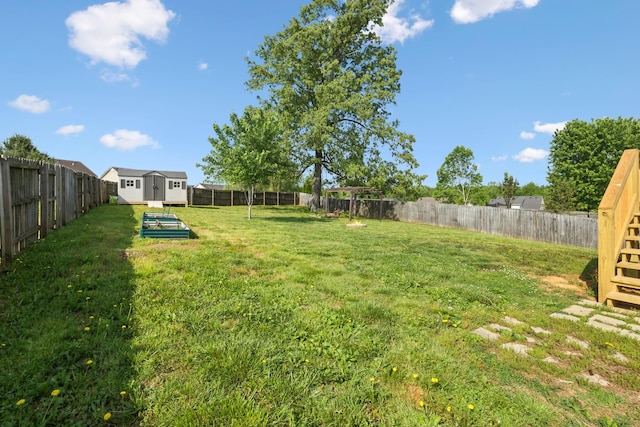 view of yard with a storage shed and an outbuilding