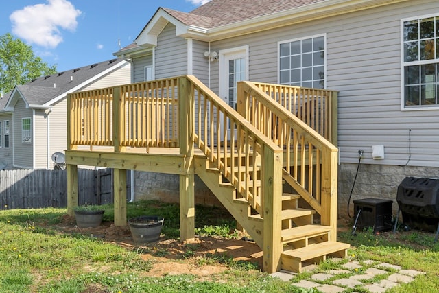 wooden deck featuring stairway and fence
