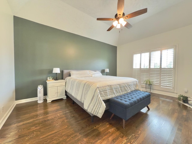 bedroom featuring dark wood-style flooring, lofted ceiling, baseboards, and ceiling fan