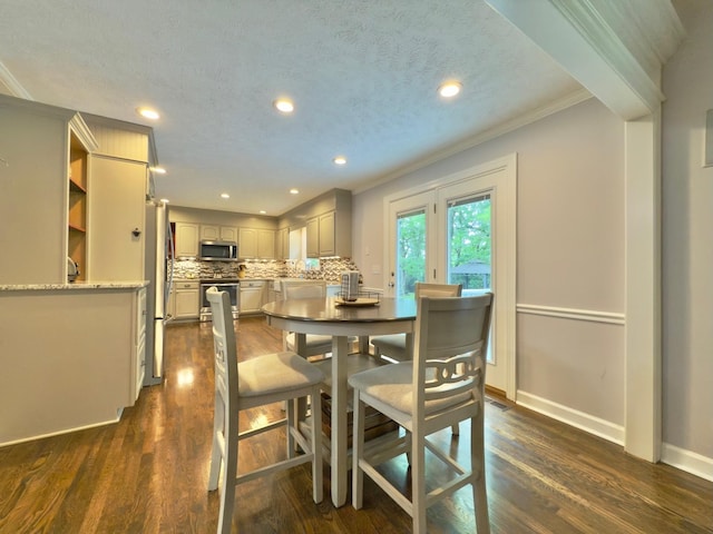 dining space with baseboards, recessed lighting, dark wood finished floors, and crown molding