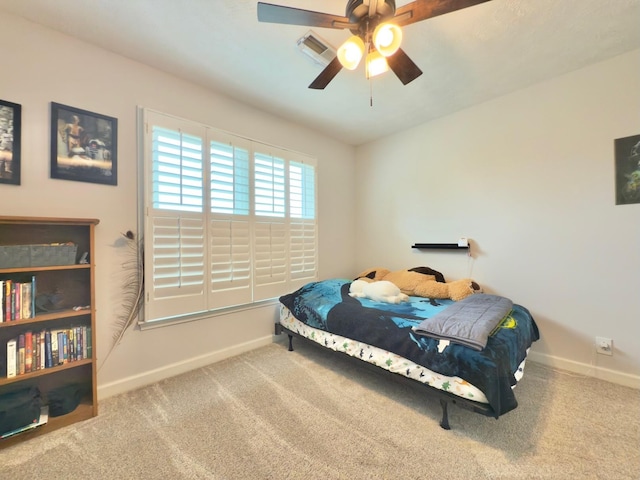 bedroom with baseboards, carpet flooring, and visible vents