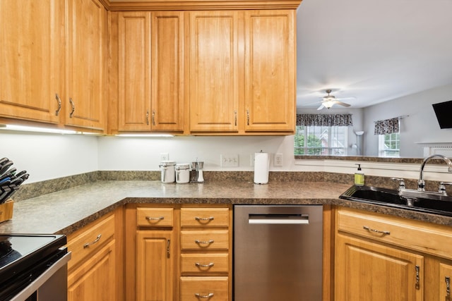 kitchen featuring brown cabinets, a sink, dark countertops, stainless steel dishwasher, and ceiling fan