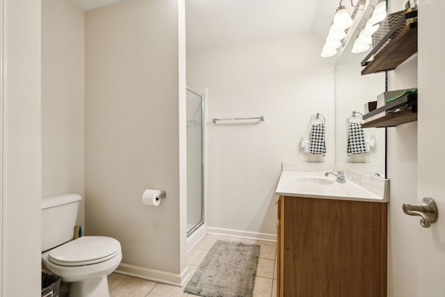 bathroom with vanity, toilet, a shower stall, and tile patterned floors