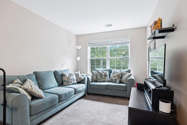 carpeted living room featuring visible vents