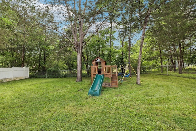 view of play area with a yard and fence