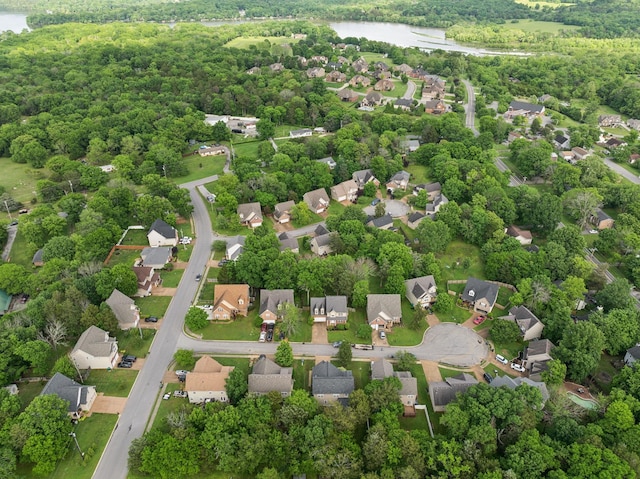 birds eye view of property featuring a water view and a residential view
