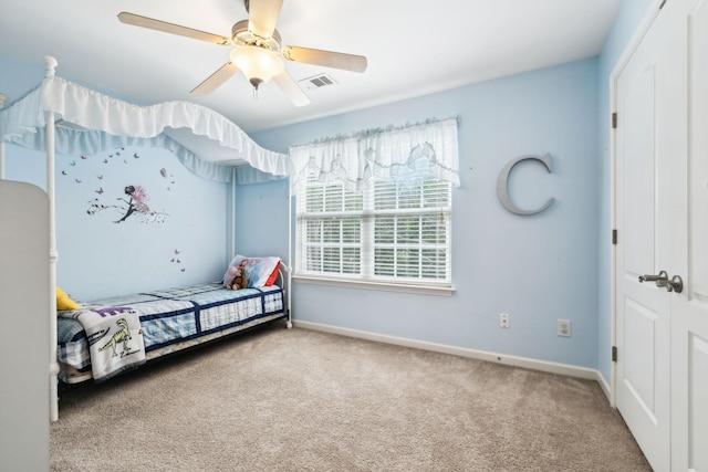 bedroom with ceiling fan, carpet, baseboards, and visible vents