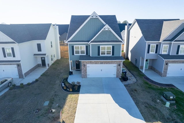 view of front of house featuring concrete driveway, board and batten siding, an attached garage, and stone siding
