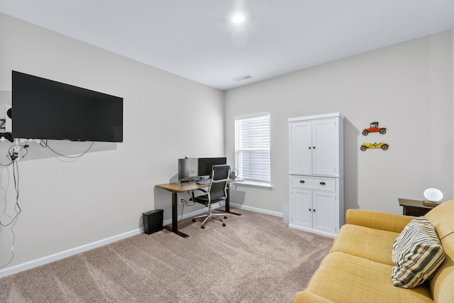 office featuring light colored carpet, baseboards, and visible vents