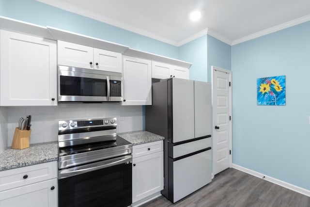 kitchen featuring white cabinetry, crown molding, decorative backsplash, dark wood-type flooring, and stainless steel appliances