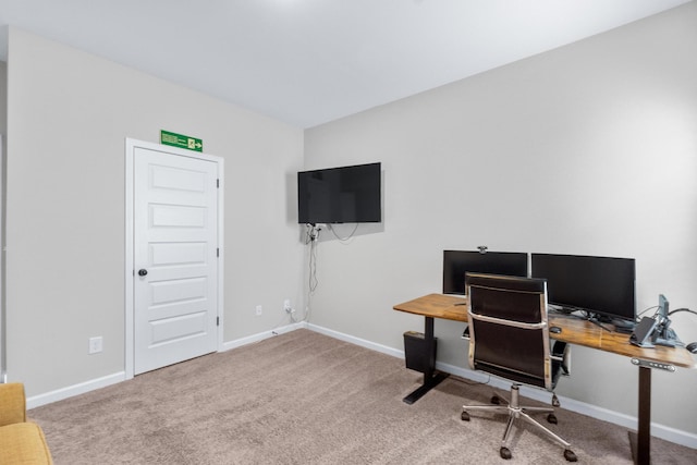 office space featuring baseboards and carpet