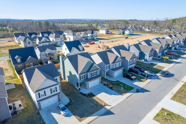 birds eye view of property with a residential view