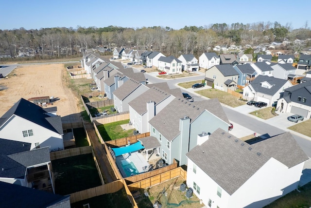 birds eye view of property with a residential view