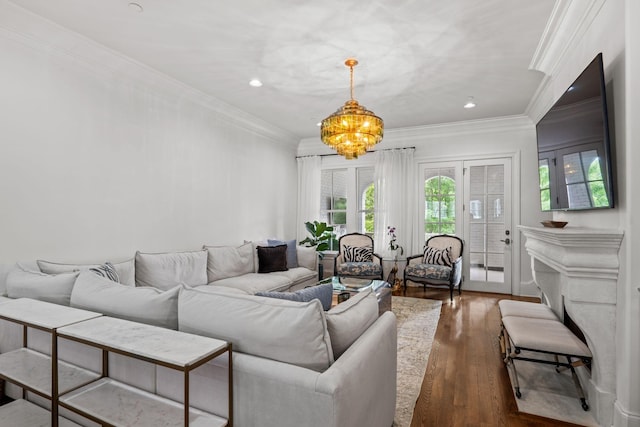 living room featuring crown molding, dark wood finished floors, a chandelier, and recessed lighting