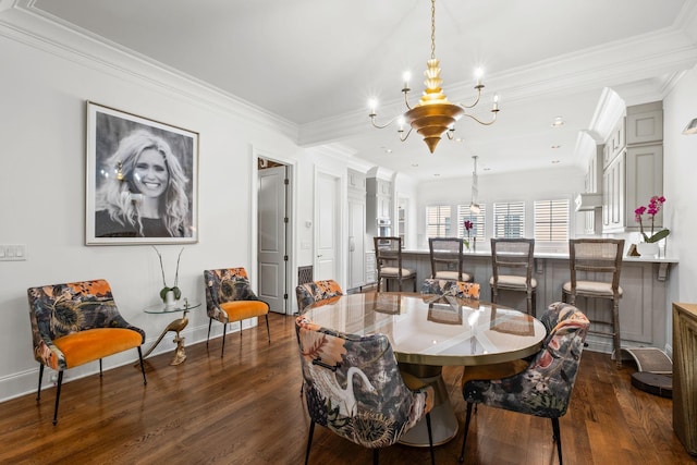 dining space with a chandelier, dark wood-style flooring, baseboards, and ornamental molding