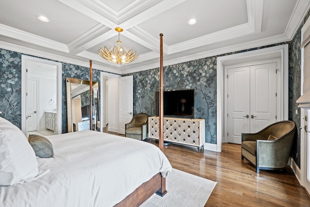 bedroom featuring a chandelier, beamed ceiling, wallpapered walls, and wood finished floors