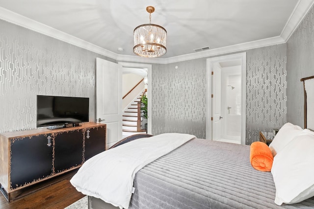 bedroom featuring ornamental molding, a chandelier, visible vents, and wood finished floors