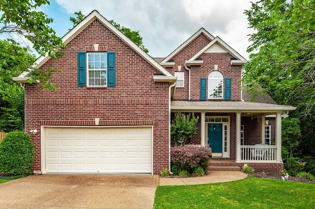 1040 Mansker Farm Blvd, Hendersonville, TN 37075 - traditional-style home with concrete driveway, brick siding, a garage, and a porch