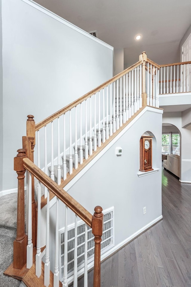 1040 Mansker Farm Blvd, Hendersonville, TN 37075 - staircase with recessed lighting, baseboards, wood finished floors, arched walkways, and a high ceiling
