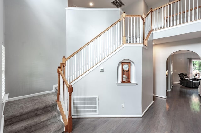 1040 Mansker Farm Blvd, Hendersonville, TN 37075 - stairs featuring arched walkways, wood finished floors, baseboards, and a high ceiling