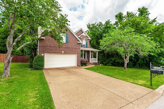 1040 Mansker Farm Blvd, Hendersonville, TN 37075 - view of front facade featuring brick siding, driveway, an attached garage, and covered porch