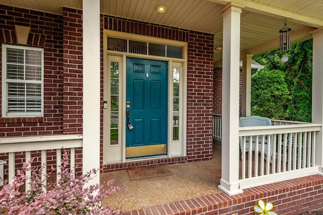 1040 Mansker Farm Blvd, Hendersonville, TN 37075 - doorway to property with brick siding and covered porch