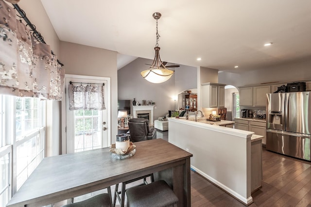 1040 Mansker Farm Blvd, Hendersonville, TN 37075 - kitchen featuring stainless steel refrigerator with ice dispenser, arched walkways, a fireplace, dark wood-style flooring, and light countertops