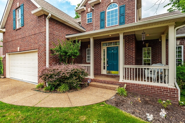 1040 Mansker Farm Blvd, Hendersonville, TN 37075 - property entrance featuring brick siding, covered porch, a garage, and roof with shingles