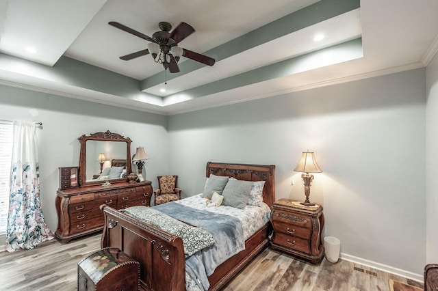 1040 Mansker Farm Blvd, Hendersonville, TN 37075 - bedroom with a raised ceiling, light wood-style flooring, ornamental molding, baseboards, and ceiling fan