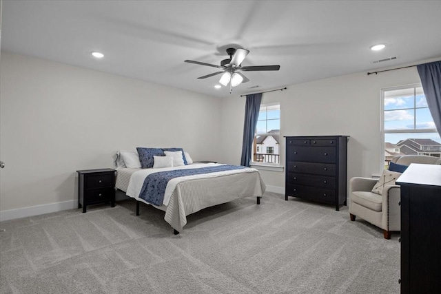 carpeted bedroom featuring baseboards, a ceiling fan, visible vents, and recessed lighting