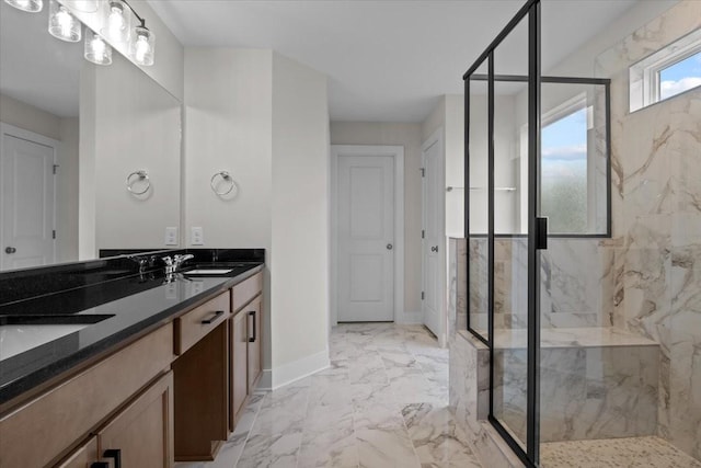 full bathroom with double vanity, a marble finish shower, a sink, baseboards, and marble finish floor