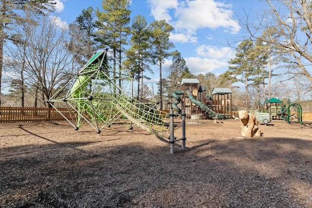 community jungle gym featuring fence